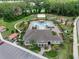 Aerial view of the community center, pool, playground, and parking lot at 219 Meghan Cir, Deland, FL 32724