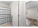 Hallway view into bedroom showcasing bathroom with a white-patterned shower curtain, highlighting accessibility and style at 219 Meghan Cir, Deland, FL 32724