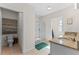 Bright bathroom featuring double sinks, granite countertops, and a walk-in shower at 219 Meghan Cir, Deland, FL 32724