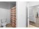 Bathroom featuring a toilet and tub with striped curtain, with tile floor at 219 Meghan Cir, Deland, FL 32724