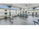Gym with cardio machines, weight equipment, rubber flooring and multiple TVs and a ceiling fan at 219 Meghan Cir, Deland, FL 32724