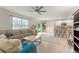 Spacious living area with seamless flow from the kitchen to the living room, with sliding door access to the yard at 219 Meghan Cir, Deland, FL 32724