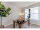 Well-lit home office featuring wood floors, stylish lighting, and lush greenery, creating a tranquil atmosphere at 219 Meghan Cir, Deland, FL 32724