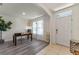 Bright home office with wood floors, modern light fixture, and large window, perfect for productivity at 219 Meghan Cir, Deland, FL 32724