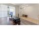 Functional home office with wood floors, a large window, and ample space, offering versatile usage at 219 Meghan Cir, Deland, FL 32724