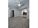 Open living space with sleek floors adjacent to the modern kitchen at 2207 Antigua Pl # 736, Kissimmee, FL 34741