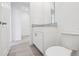 Clean bathroom with granite countertops, white cabinets and tile flooring at 2310 White Tail St, Davenport, FL 33837