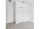 Comfortable bedroom featuring neutral carpet and a closet with double doors at 2310 White Tail St, Davenport, FL 33837