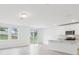 A modern kitchen with stainless steel appliances, a center island and a tile floor at 2310 White Tail St, Davenport, FL 33837