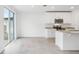 A modern kitchen with stainless steel appliances, granite countertops and a tile floor at 2310 White Tail St, Davenport, FL 33837