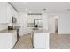 Bright kitchen boasts granite countertops, stainless appliances, and ample cabinet space at 2310 White Tail St, Davenport, FL 33837