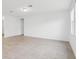 A large living room space with ample natural light and tile flooring at 2310 White Tail St, Davenport, FL 33837