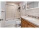 Bathroom with a shower and tub combination, a single sink vanity with granite countertop at 2466 R E Byrd Rd, Frostproof, FL 33843