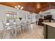 Spacious dining area with white wood furniture, and a wood ceiling at 2466 R E Byrd Rd, Frostproof, FL 33843