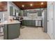 Well-equipped kitchen featuring shaker cabinets, stainless steel appliances, and a tiled backsplash at 2466 R E Byrd Rd, Frostproof, FL 33843