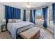 Serene main bedroom featuring light wood floors, natural light, and a cozy window nook at 2466 R E Byrd Rd, Frostproof, FL 33843