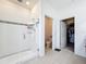 Bright bathroom featuring glass-door shower room, toilet room, and a walk-in closet at 249 Hamlet Loop, Davenport, FL 33837