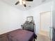 Bedroom features a dark dresser with decor at 249 Hamlet Loop, Davenport, FL 33837