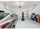 Spacious garage with a parked car and ample space for storage at 249 Hamlet Loop, Davenport, FL 33837