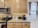This kitchen has a stainless steel microwave and range, plus granite countertops at 249 Hamlet Loop, Davenport, FL 33837