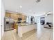 Open kitchen featuring granite countertops, stainless steel appliances, and tile flooring at 249 Hamlet Loop, Davenport, FL 33837