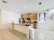 Open kitchen featuring granite countertops, stainless steel appliances, and tile flooring at 249 Hamlet Loop, Davenport, FL 33837