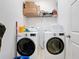 Laundry room with modern appliances, including a washer and dryer at 249 Hamlet Loop, Davenport, FL 33837