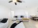 Spacious living room featuring neutral walls, tile flooring, and a comfortable sectional sofa at 249 Hamlet Loop, Davenport, FL 33837