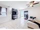 Inviting living room featuring tile floors, modern décor, and sliding glass doors to the outside at 249 Hamlet Loop, Davenport, FL 33837
