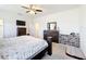 Spacious bedroom with carpeted floors, ceiling fan, and large dresser at 249 Hamlet Loop, Davenport, FL 33837
