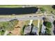 Aerial view of homes, water, and green space at 25 Lakeshore Blvd, St Cloud, FL 34769