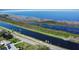 Elevated view of the canal, neighboring community, and natural landscape, showing the desirable location at 25 Lakeshore Blvd, St Cloud, FL 34769