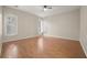 Bedroom with wood floors and bright windows with custom shutters at 25 Lakeshore Blvd, St Cloud, FL 34769