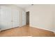 Bedroom with wood floors and white doors to the closet at 25 Lakeshore Blvd, St Cloud, FL 34769
