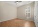 Bedroom with wood floors and bright windows with custom shutters at 25 Lakeshore Blvd, St Cloud, FL 34769
