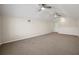 Spacious bonus room with carpet, ceiling fans and natural light at 25 Lakeshore Blvd, St Cloud, FL 34769