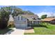 Charming two-story home with a manicured lawn, and a welcoming front porch at 25 Lakeshore Blvd, St Cloud, FL 34769