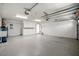 Spacious garage with ample storage, utility sink, and well-lit work area at 25 Lakeshore Blvd, St Cloud, FL 34769