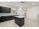 Bright kitchen with stainless steel appliances, gray cabinets, and an island at 25 Lakeshore Blvd, St Cloud, FL 34769