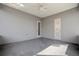 Neutral patio with fan, gray walls, and light entering from windows at 25 Lakeshore Blvd, St Cloud, FL 34769