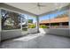 Inviting screened porch offering a relaxing outdoor living space with views of the surrounding neighborhood at 25 Lakeshore Blvd, St Cloud, FL 34769