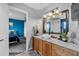 Elegant bathroom featuring a modern vessel sink on a wooden vanity and a large framed mirror at 2933 White Cedar Cir, Kissimmee, FL 34741