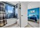 Blue bathroom with a shower-tub combo, providing a refreshing and functional space at 2933 White Cedar Cir, Kissimmee, FL 34741