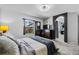 Inviting bedroom with plush carpet, natural light from the window, and a walk through into the bathroom at 2933 White Cedar Cir, Kissimmee, FL 34741