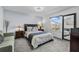 Comfortable bedroom with plush carpet, natural light, and tasteful decor at 2933 White Cedar Cir, Kissimmee, FL 34741