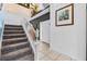 Inviting entryway with tile flooring, staircase, and white front door for a bright, clean aesthetic at 2933 White Cedar Cir, Kissimmee, FL 34741