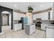 Bright and modern kitchen featuring white cabinets, a center island and stainless steel appliances at 2933 White Cedar Cir, Kissimmee, FL 34741