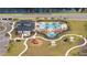 Aerial view of community amenities including pool, playground, lounge chairs, and landscaping at 2984 Sanctuary Dr, Clermont, FL 34714