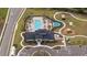 Overhead view showcasing the community pool, splash pad, clubhouse, and playground at 2984 Sanctuary Dr, Clermont, FL 34714
