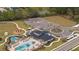 Overhead view showcasing the community pool, clubhouse, playground, and parking area at 2984 Sanctuary Dr, Clermont, FL 34714
